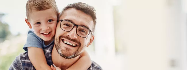 Smiling father and son